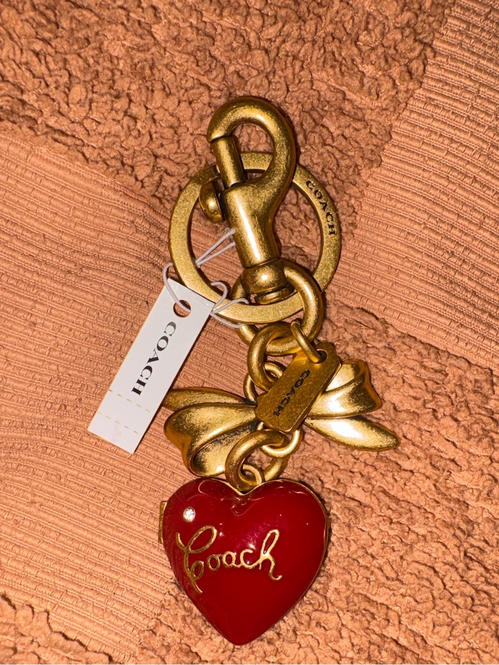 Coach heart bow keychain locket